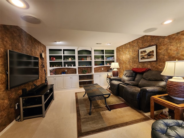 living room with carpet and built in shelves