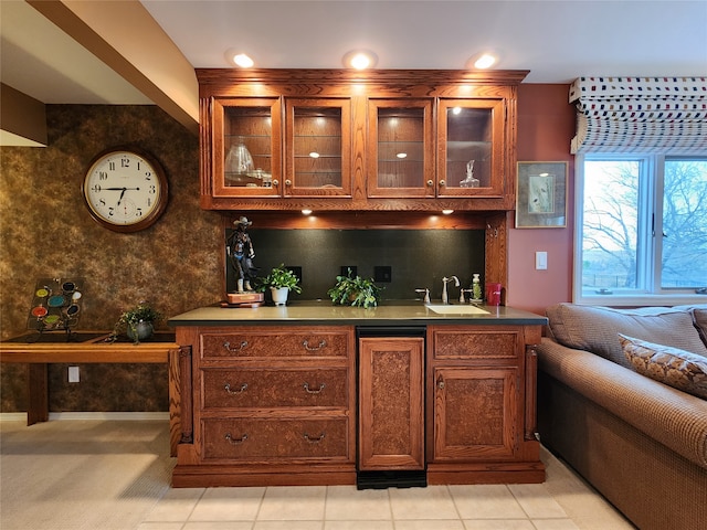 bar with light tile patterned floors and sink