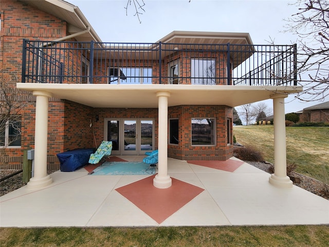 view of patio / terrace featuring french doors and a balcony