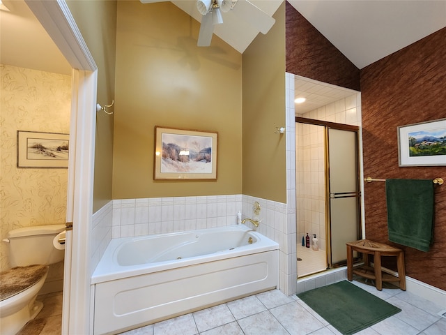 bathroom with tile patterned flooring, toilet, lofted ceiling, and independent shower and bath