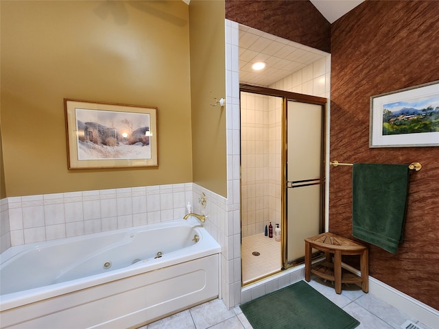 bathroom with tile patterned flooring and separate shower and tub