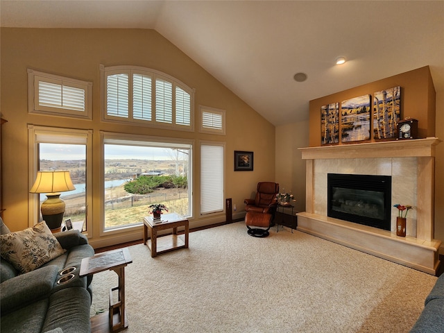 living room featuring carpet flooring and high vaulted ceiling