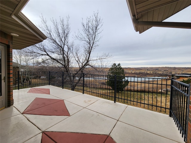 view of patio with a water view