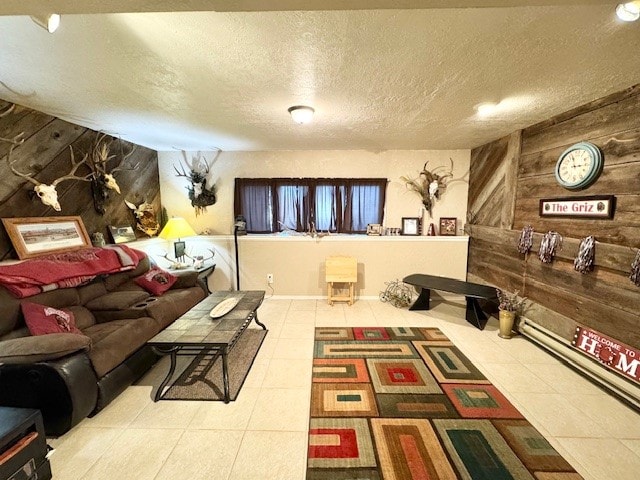 tiled living room with a textured ceiling and wooden walls