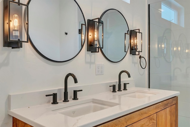 full bath featuring double vanity and a sink