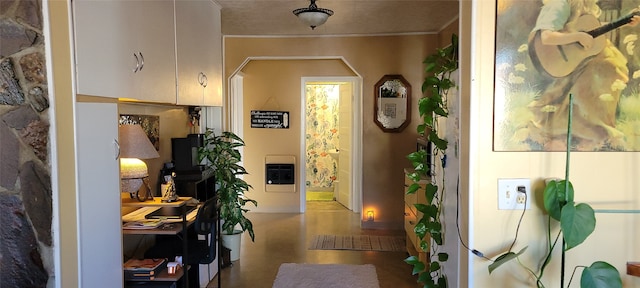 hallway featuring hardwood / wood-style flooring and heating unit