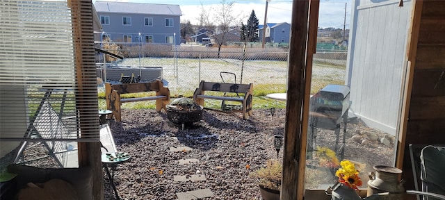 view of yard with an outdoor fire pit