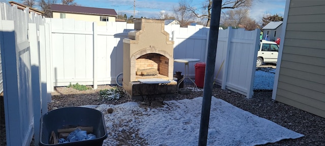 view of patio / terrace featuring exterior fireplace