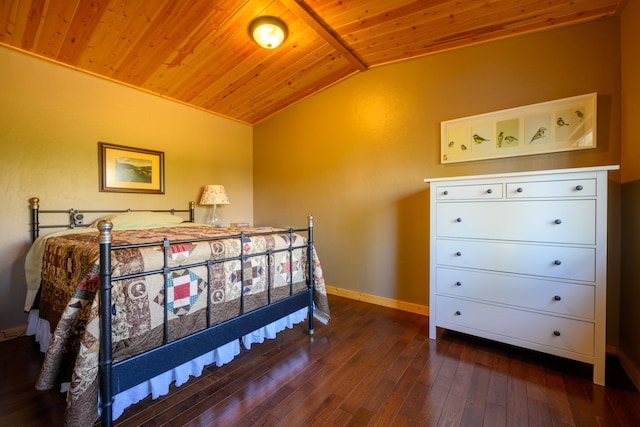 bedroom with lofted ceiling, dark wood-type flooring, and wooden ceiling