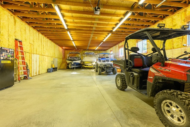 garage with black fridge