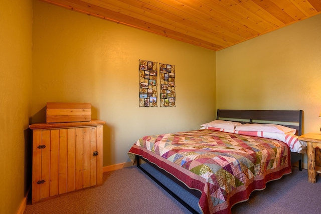 carpeted bedroom featuring wood ceiling