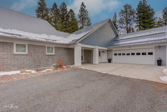 31B Stoney Brook Dr Unit B, Clancy, MT 59634 - view of front of home with driveway, an attached garage, and a metal roof