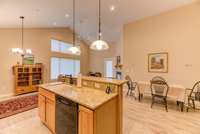 31B Stoney Brook Dr Unit B, Clancy, MT 59634 - kitchen featuring dishwasher, high vaulted ceiling, a kitchen island with sink, pendant lighting, and light stone countertops