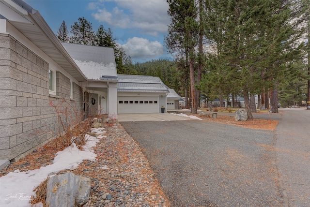 view of side of home with a garage