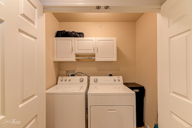 laundry area featuring cabinets and washer and dryer