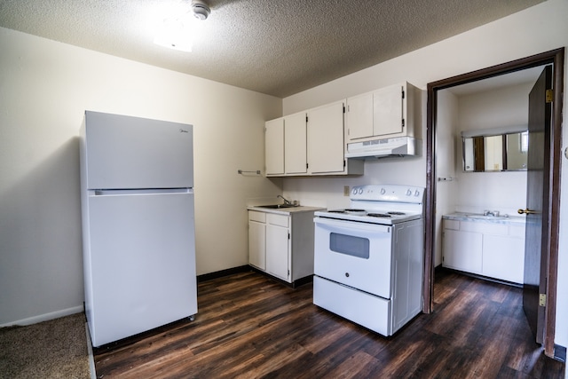 kitchen featuring a textured ceiling, white cabinetry, white appliances, and dark wood-type flooring