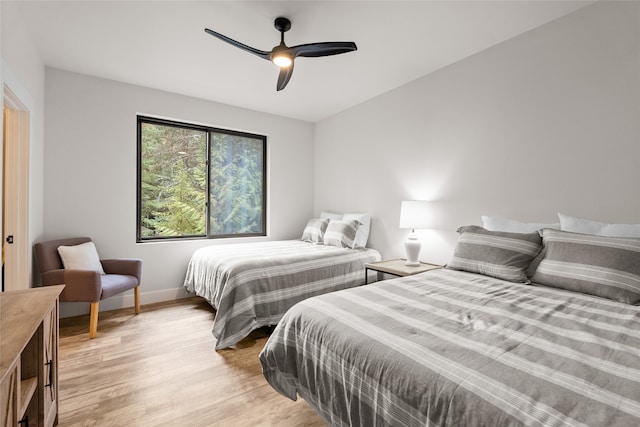 bedroom with ceiling fan and light hardwood / wood-style floors