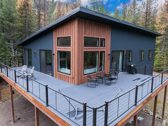 rear view of house featuring a deck