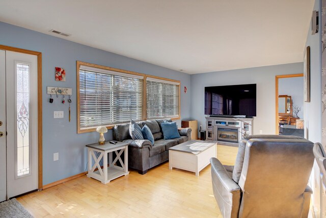 living room with light hardwood / wood-style flooring