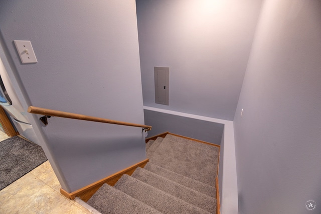 staircase featuring tile patterned floors