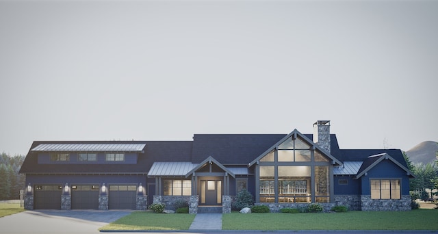 view of front of home featuring a front lawn and a garage