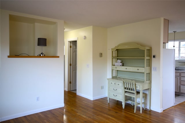 kitchen with dark wood-type flooring