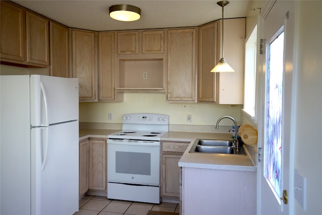 kitchen featuring pendant lighting, a healthy amount of sunlight, white appliances, and sink