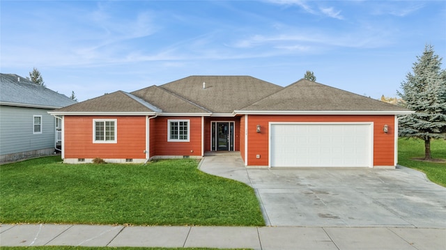 ranch-style house with a garage and a front lawn