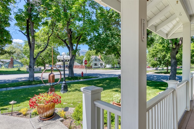 view of yard featuring covered porch