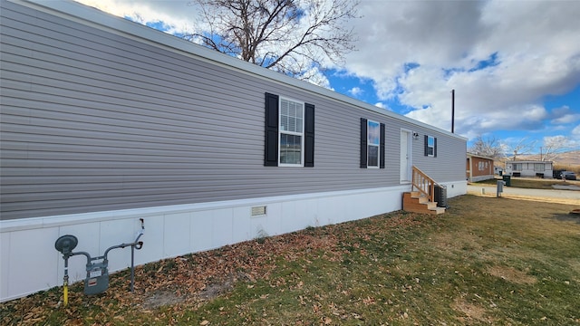 view of home's exterior featuring a yard