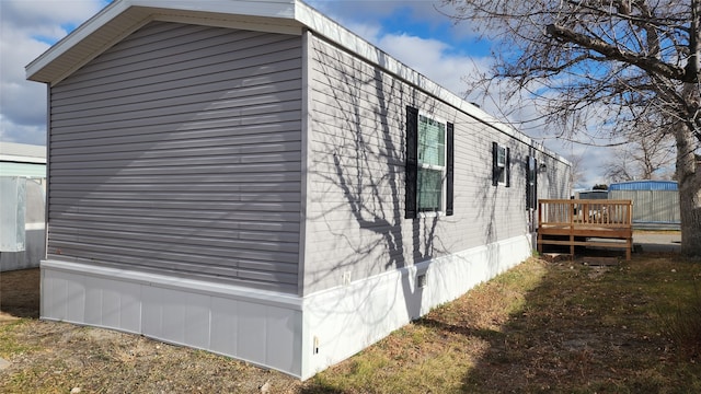 view of property exterior featuring a deck