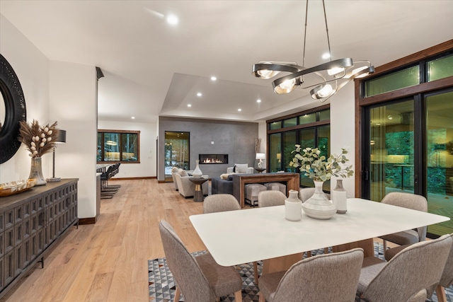 dining room featuring light hardwood / wood-style floors and a notable chandelier