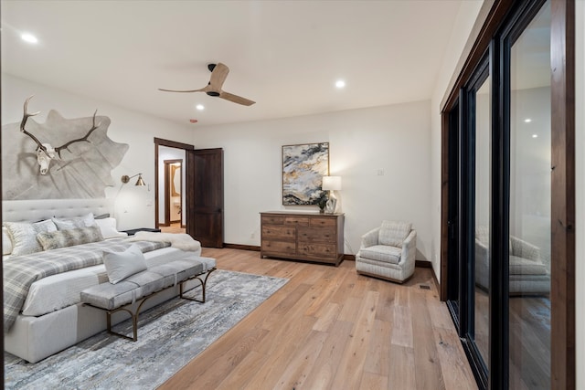 bedroom featuring access to outside, light hardwood / wood-style floors, and ceiling fan