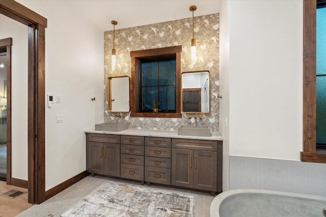 bathroom with hardwood / wood-style floors and vanity