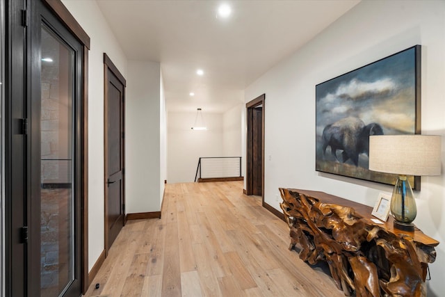 92 Woodlandstar Cir, Whitefish, MT 59937 - hall with baseboards, light wood-style floors, and recessed lighting