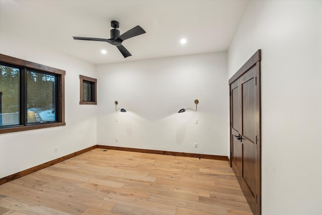 spare room featuring ceiling fan and light hardwood / wood-style floors