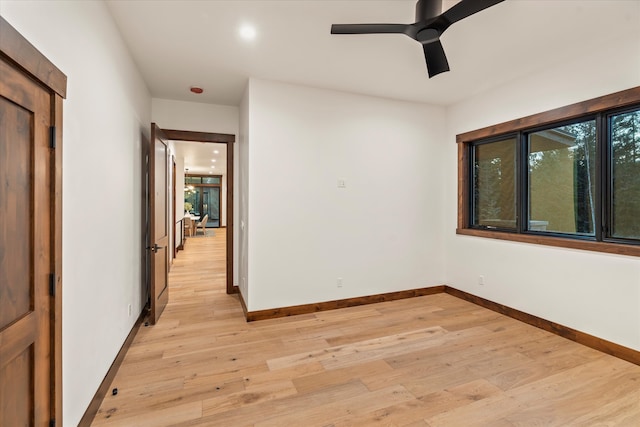 unfurnished room featuring light hardwood / wood-style floors and ceiling fan