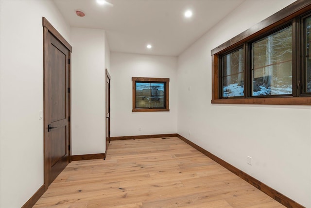 92 Woodlandstar Cir, Whitefish, MT 59937 - hall with light wood-type flooring, baseboards, and recessed lighting