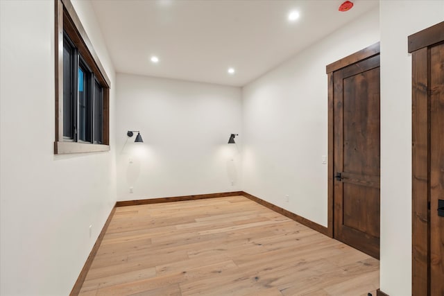 spare room with light hardwood / wood-style floors