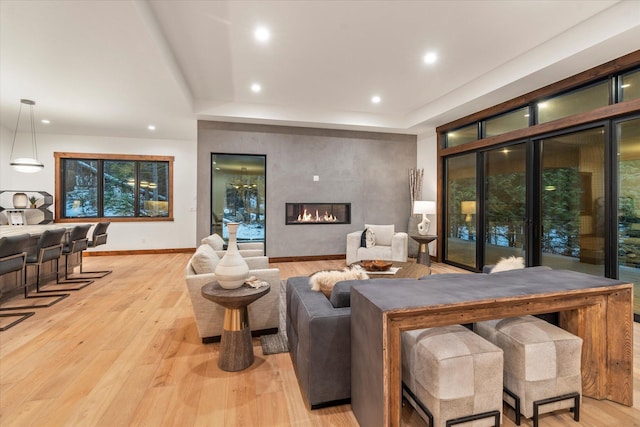 92 Woodlandstar Cir, Whitefish, MT 59937 - living area with light wood-style flooring, baseboards, recessed lighting, and a fireplace