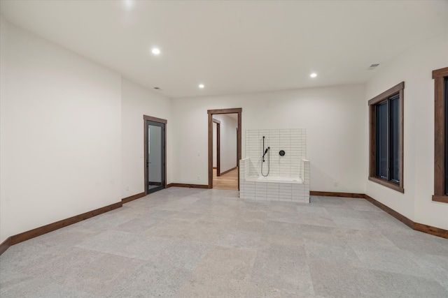 unfurnished room with light colored carpet