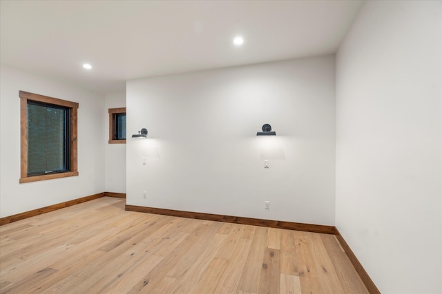 spare room featuring light hardwood / wood-style flooring