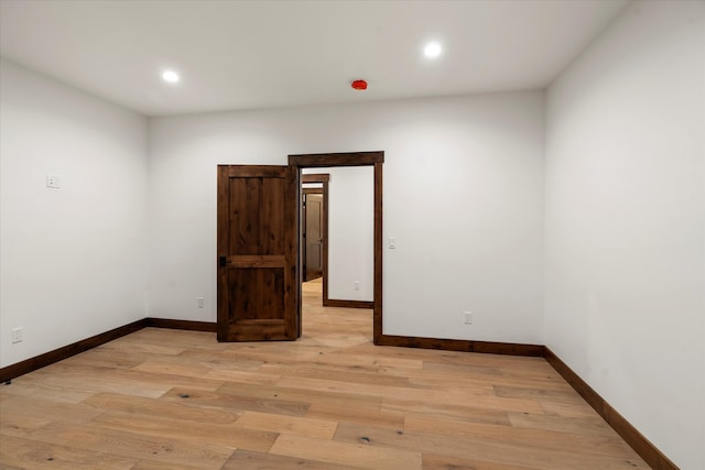 spare room featuring light wood-type flooring