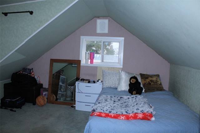 bedroom featuring carpet floors and vaulted ceiling