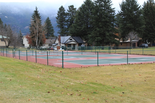 view of sport court with a lawn and a mountain view