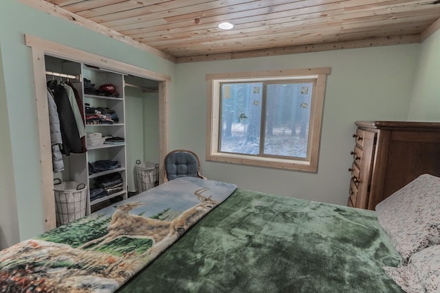 bedroom with a closet and wooden ceiling