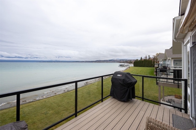 100 Rocky Point Rd Unit F5, Polson, MT 59860 - wooden deck featuring a water view and a grill