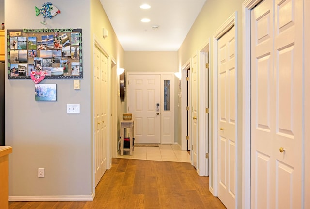 100 Rocky Point Rd Unit F5, Polson, MT 59860 - hall featuring wood finished floors, baseboards, and recessed lighting
