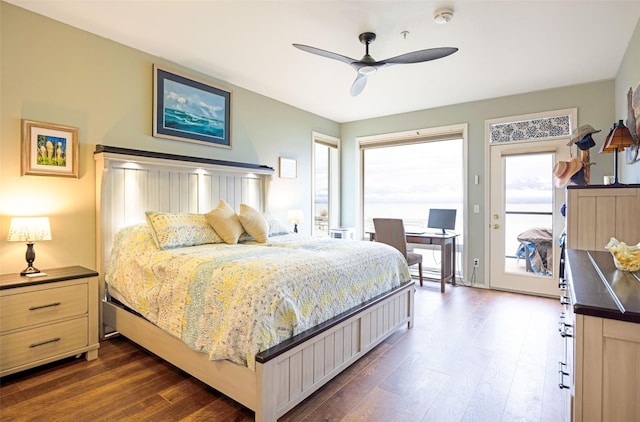 100 Rocky Point Rd Unit F5, Polson, MT 59860 - bedroom with dark wood-style floors, access to outside, a desk, and a ceiling fan