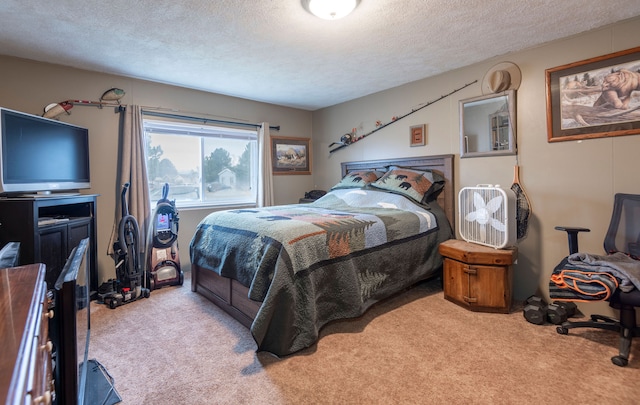 carpeted bedroom featuring a textured ceiling